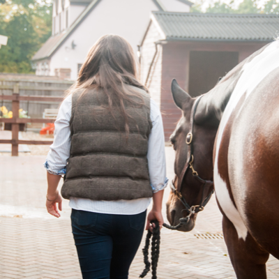 Rider leading horse away