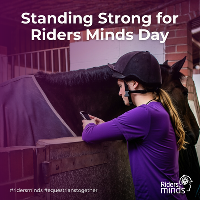 Woman in a riding hat looking at her phone next to a horse in a stable, with the headline "Standing Strong for Riders Minds Day".