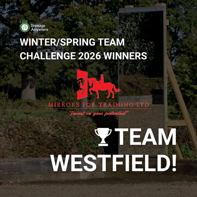 Background: Features an outdoor equestrian arena scene with a large, free-standing outdoor dressage mirror mounted on a wooden frame next to trees and fencing. Top Left: the Dressage Anywhere round green logo. Centre Branding: Displays the red logo for Mirrors for Training prominently centred over the arena backdrop. Main Headline Text:Top text (bold white, upper case): WINTER/SPRING TEAM CHALLENGE 2026 WINNERS  Bottom text (large bold white, upper case with a trophy icon): 🏆 TEAM WESTFIELD!